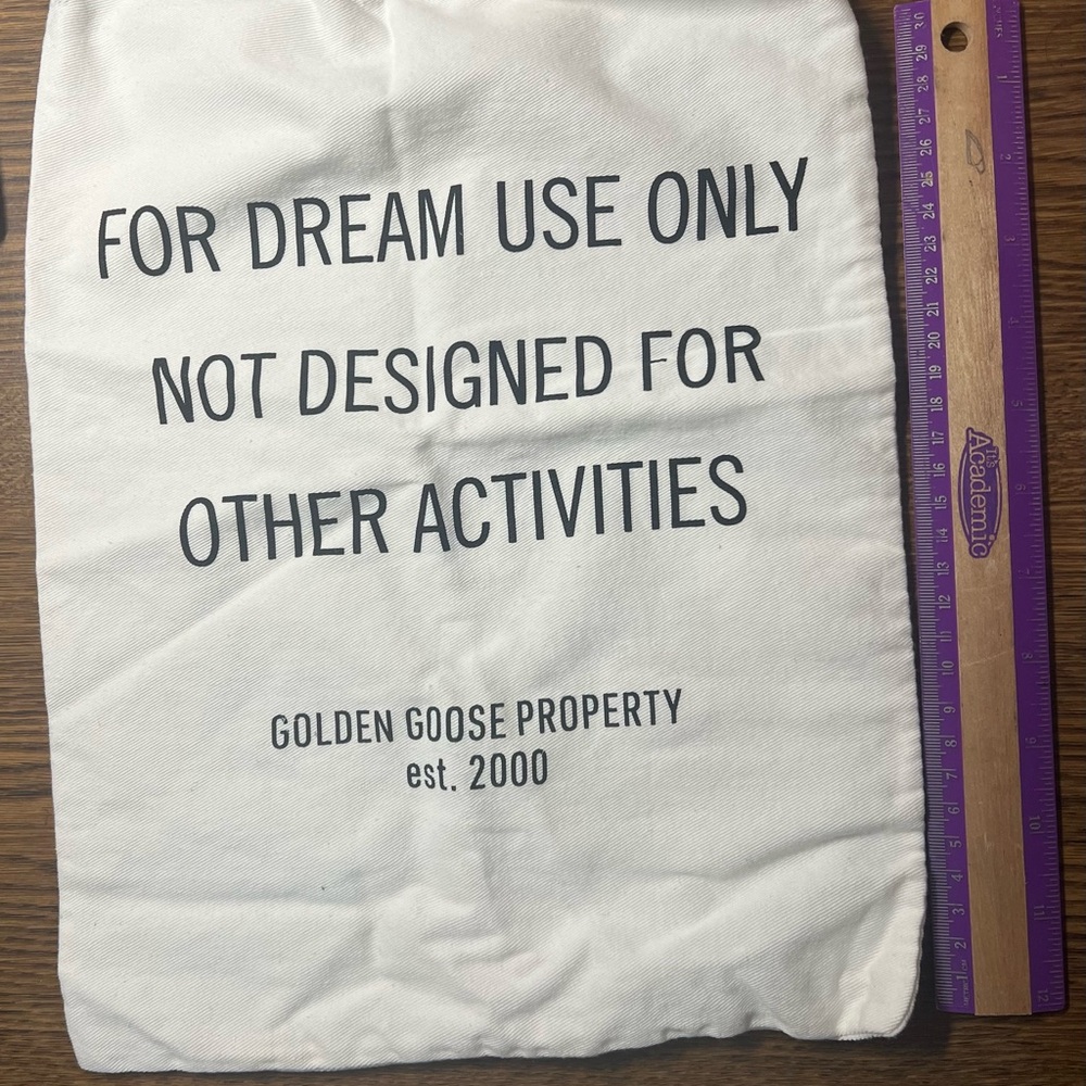 Golden Goose Cream Drawstring Bag with Black Text